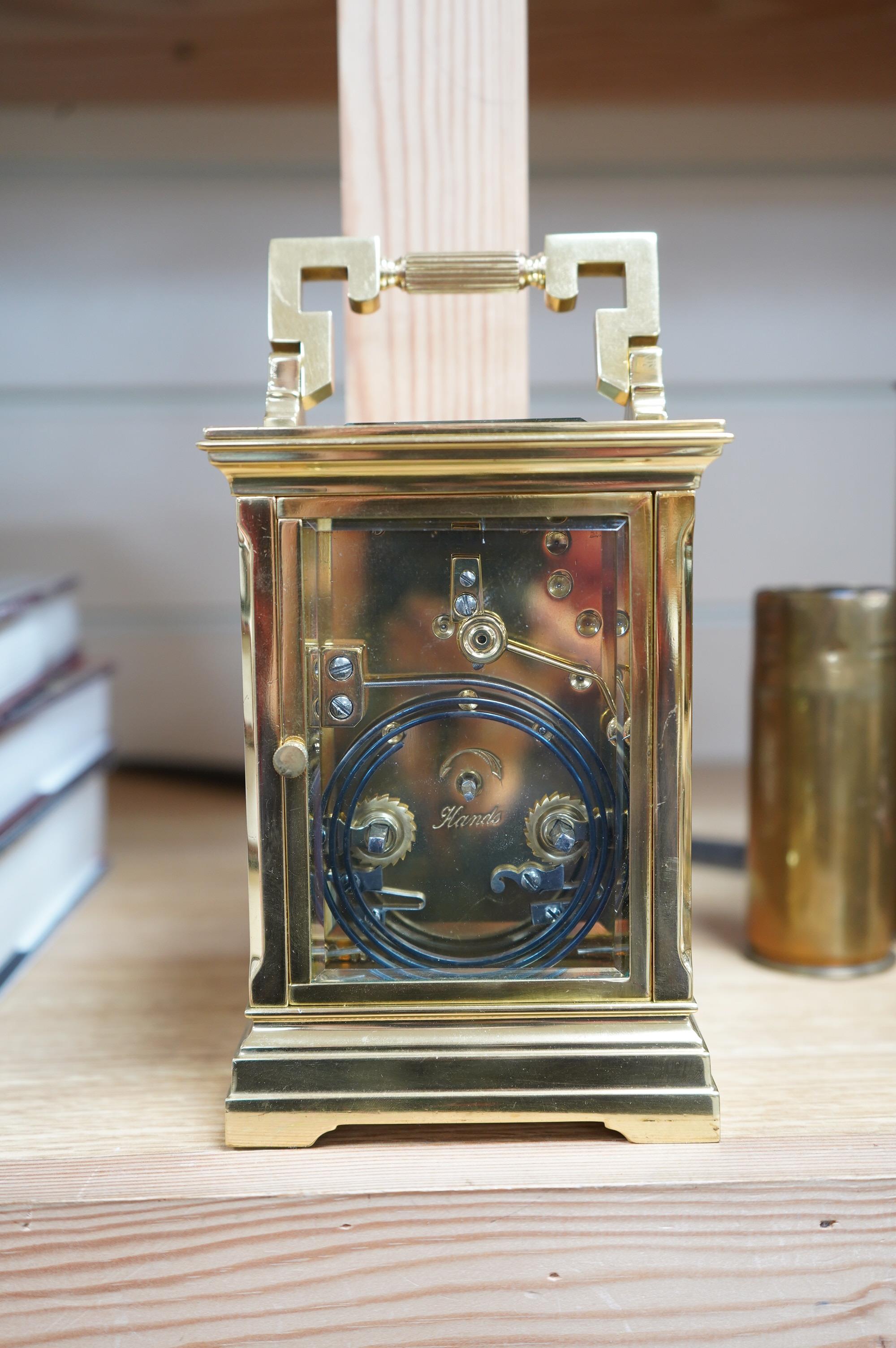 A brass cased carriage clock, the dial inscribed Shepheard & Company, no key, 18cm high. Condition - good, untested